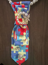 Load image into Gallery viewer, Autism Awareness Puzzle Tie Necklace – Pearl Statement Jewelry