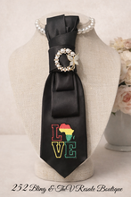 Load image into Gallery viewer, Pan-African LOVE Statement Necktie Necklace – Black Satin Tie with Pearl Butterfly Brooch | Upcycled Fashion | 252 Bling & The V Resale Boutique
