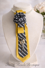Load image into Gallery viewer, Golden Statement Necktie Necklace with Fashion Figure Pendant and Black &amp; White Rosette – Upcycled Women’s Accessory
